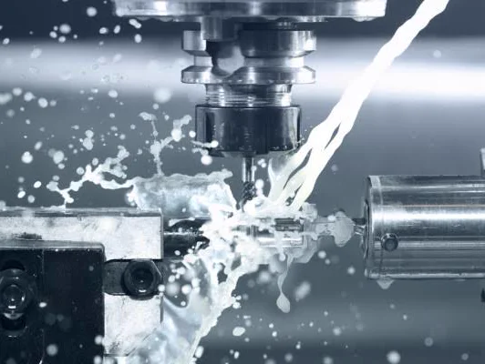 End mill cutting a steel part under high-pressure coolant